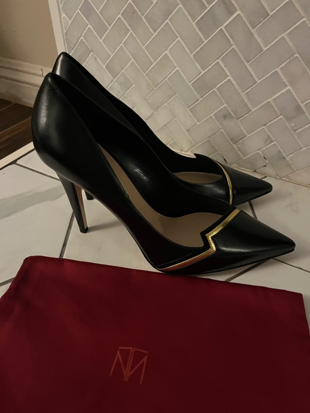 Tamara Mellon Black Pointed Leather Pumps with Gold Accent